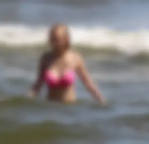 Two sexy beach teens in bikinis, one thick and one skinny with big boobs