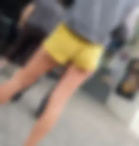 Skinny ass eating her yellow shorts