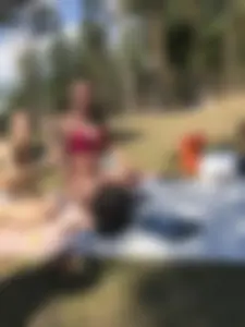 Hot Skinny Candid Girl in Swimsuit Squatting on the Grass in the Nature Park
