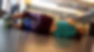 Sexy blonde girl at the gym in leggings doing yoga