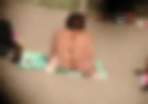 Topless girl on the beach showing some pussy lips in her little thong