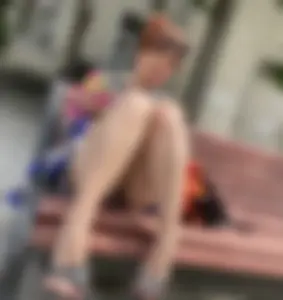 Mature Redhead in a Dress Flashing Panties While Sitting on a Street Bench