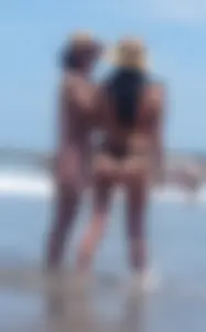 2 milfs in thong bikinis on the beach