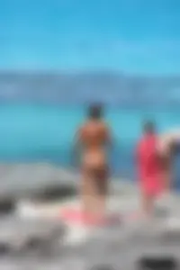 Older lady on a nude beach showing her body