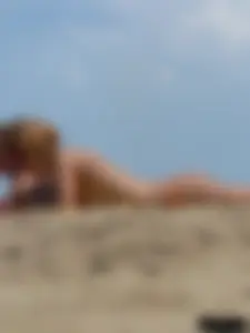 Two topless friends on the beach with nice boobs