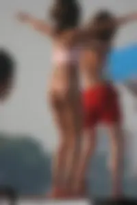 A bunch of sexy beach voyeur babes in bikinis, thongs and topless
