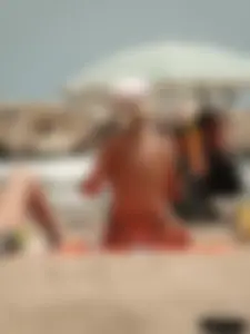 Tattooed blonde with big tits topless and in thong