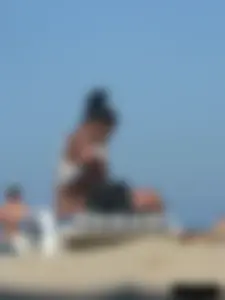 Hot ass topless beach girl with great tits lets her little brother oil up her ass in thong bikini