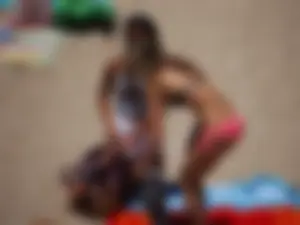 Beach volleyball babe with a nice ass in pink bikini bottom