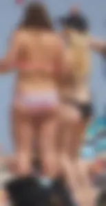 Two thick white girls in bikinis on the beach with big asses