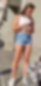 Sexy And Young Candid Girl in a Top And Denim Shorts Standing on the Street, Smoking Hot Legs Creepshot
