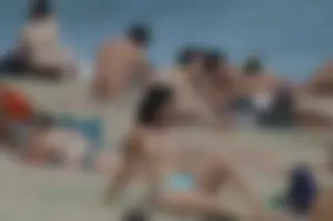 Topless girls on a beach in Barcelona
