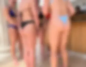 Hot babes in bikinis by pool