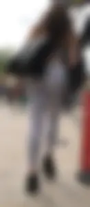 Sexy girl in see through grey leggings showing her thong