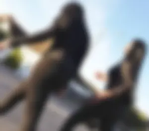 2 sexy black girls in leggings with nice asses