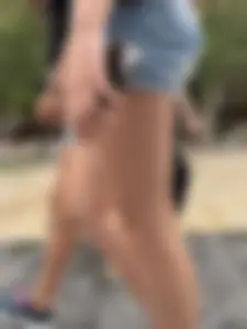 Candid teen wearing denim shorts passing by, nice legs