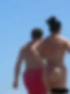 Purple thong topless lady on the beach gets oiled up by her husband