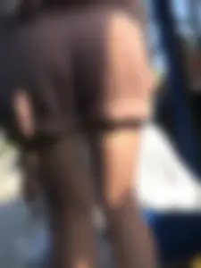 Young Girl in Sandals and Shorts in a Public Bus