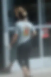 Girl going to TJ Maxx walking in the parking lot in leggings