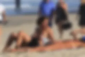 Sexy girls topless on a nude beach showing their nice tits