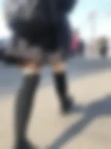 Legs in Knee-Socks And a Skirt - Young Girl Passing By on the Street