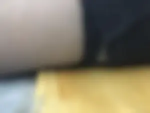 Closeup of a candid college teen girl's thigh in dark nylon stocking in a classroom creepshot