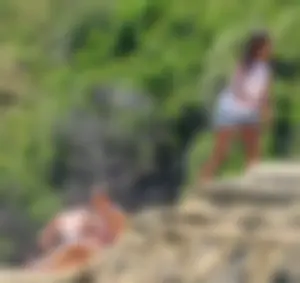 Group of sexy friends at the beach in bikinis