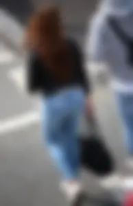 Pretty redhead in tight jeans with a nice booty