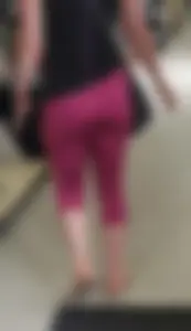 Milf shopping with a nice ass in tight maroon leggings
