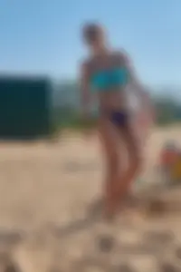 Blonde milf in blue thong bikini