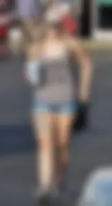 Hot blonde after shopping in short jean shorts and tank top