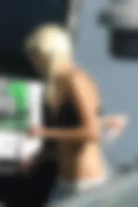 Blonde babe changing into and out of bikini and shows her tits