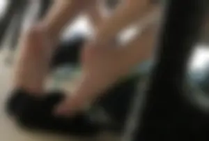 Female Feet With Flats Taken Off Under Table - Photos From College Classroom