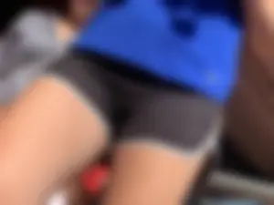 Bunch of girls in various outfits at a Cardinals baseball game