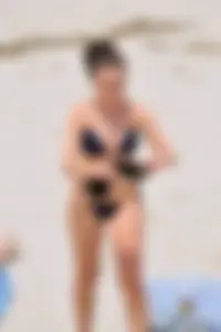 Blue bikini girl on the beach with a great ass and a little pussy lips slips