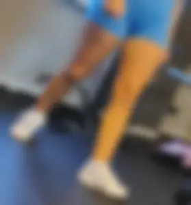 Small blonde pawg in light blue pants squatting as low as she can. Frontal view. OC