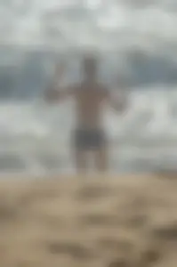 Blonde lady on the beach in bikini top and spandex shorts with a nice gap