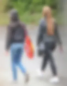 Redhead and ethnic skinny teens in tight jeans