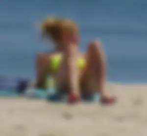 Sexy ass blonde milf on the beach in a thong with cameltoe and bending over