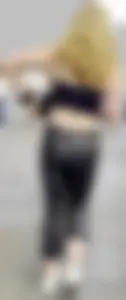 Sexy blonde in tight shiny jeans and croptop