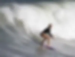 Blonde Surfer Girl in a One-Piece Swimsuit Photo Gallery