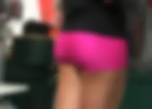 Sexy girl with a nice ass in tight pink spandex shorts
