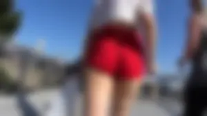 Red short shorts teen cheeks out. walking in mall