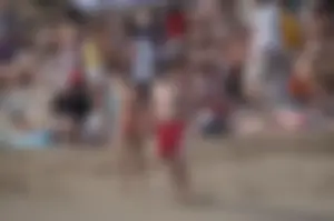 Topless girls on a beach in Barcelona
