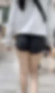 Asian girl in tight black shorts at the mall