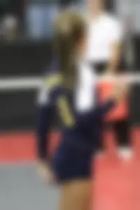 Female Volleyball Player Adjusting Her Spandex Sporting Shorts