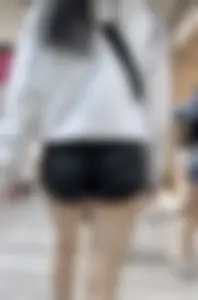 Asian girl in tight black shorts at the mall