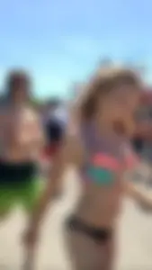 Adorable and sexy teen in colorful bikini at a water park