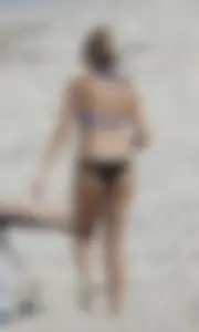 Florida blonde in blue and black bikini on the beach