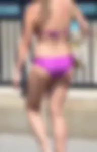 Sexy thick blonde girl in purple bikini